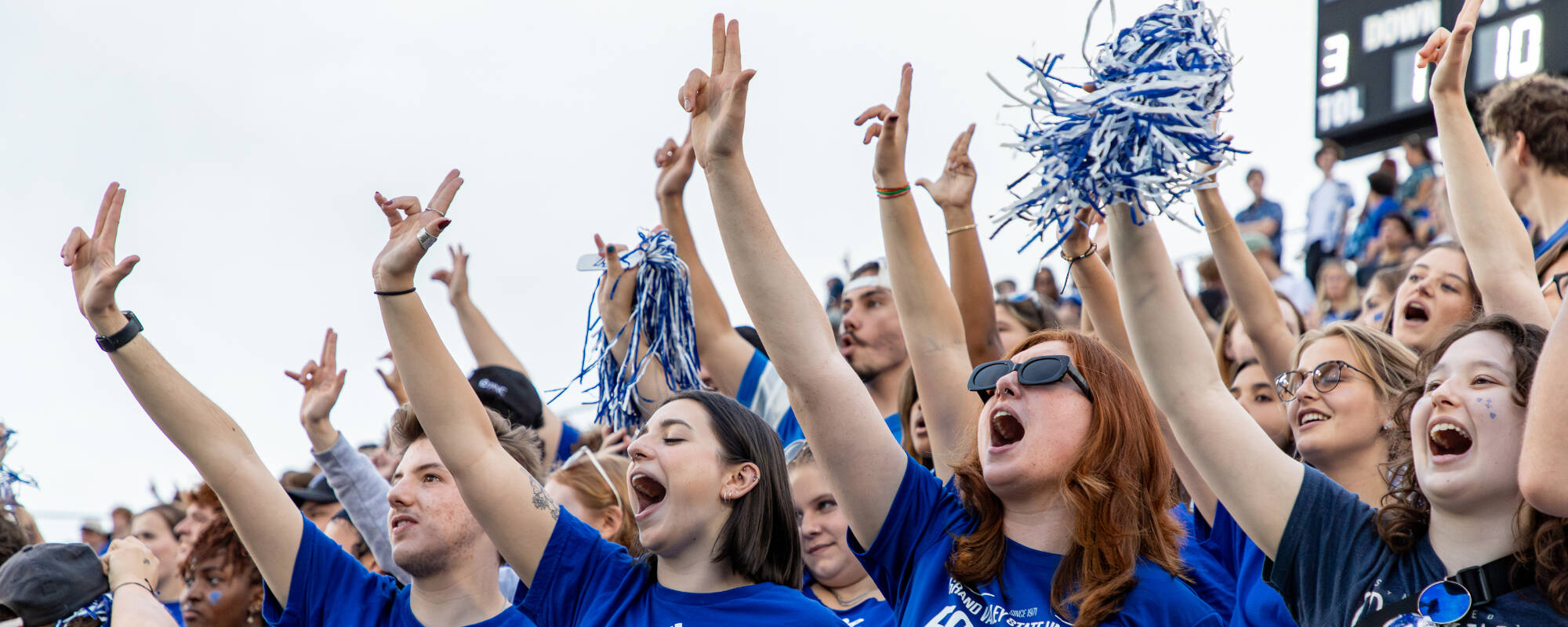 Students cheering at football game during Family Weekend 2024